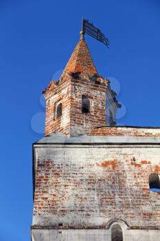 Old castle turret on blue sky background.