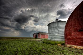 Storm Clouds Saskatchewan Red buildings granary storage