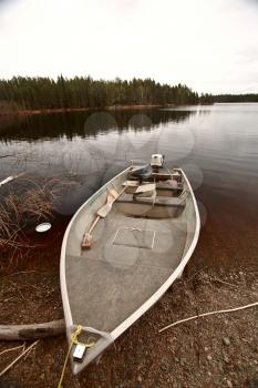 beached motor boat on Northern Manitoba lake