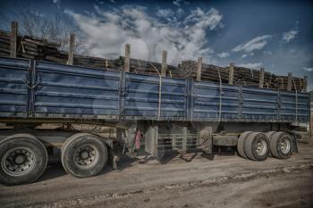 blur in south africa truck full of forest wood dirt and dust