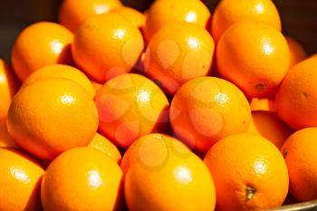 in the market lots  of fresh orange like healty food concept