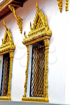 window   in   bangkok in thailand incision of the buddha gold      temple