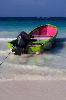 tropical lagoon boat navigable  froth cloudy  sea weed  and coastline in mexico playa del carmen
