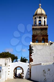 arrecife lanzarote  spain the old wall terrace church bell tower plant in teguise
