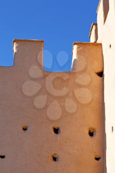 old ruin in  brown construction  africa         morocco and sky  near the tower