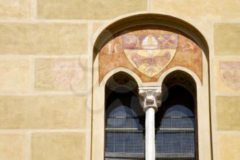 tradate varese italy abstract  window monument curch mosaic in the yellow 