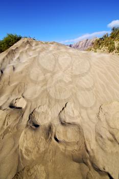 abstract yellow dune beach  hil and mountain in the   lanzarote spain 
