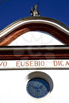  italy  lombardy     in  the  busto arsizio     old   church   closed brick tower   wall rose   window tile   