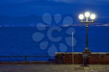 street lamp a bulb in the   sky mediterranean sea naples