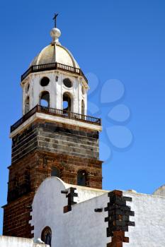 teguise   lanzarote  spain the old wall terrace church bell tower in arrecife
