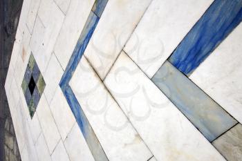 direction  sanpietrini busto arsizio  street lombardy italy  varese abstract   pavement of a curch and marble
