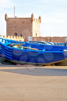   boat and sea      in africa morocco old castle brown brick  sky pier
