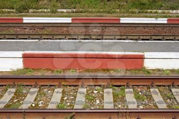 Fragment of railway tracks close up in sunny summer weather
