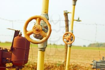 Equipment of natural gas station among autumn fields