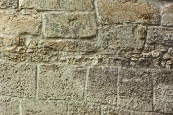 Detail of old gray stone wall with big blocks