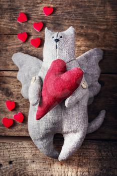 Hand-made,stuffed toy cat with wings.The symbol of Valentine's Day