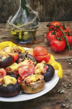 Mushrooms stuffed with cheese,tomatoes and green peppers