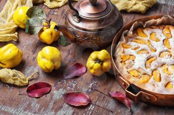 Pie autumn quinces baked in the stylish copper retro form