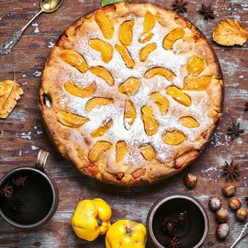 Autumn pie with slices of quince and warming cup of tea