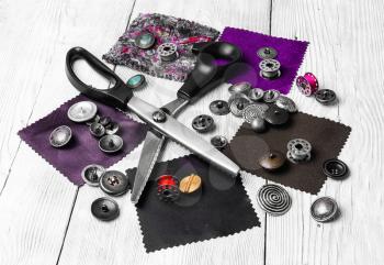sewing kit made of fabric,scissors,buttons and spools