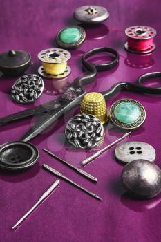Set of beautiful buttons,sewing needle and bobbin