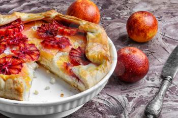 Cut into a delicious pie stuffed with oranges and grapefruits