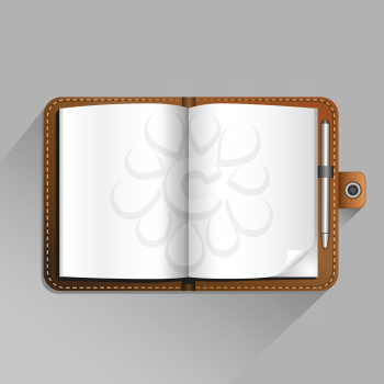 The brown open notebook with pen and top view shadow on the gray background