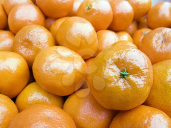 The beautiful mandarines on a counter, fruit background close up