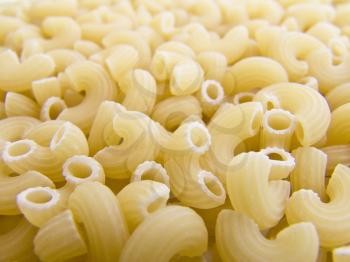 food background a pile of beautiful pasta small horns
