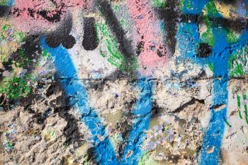 Abstract colorful paint graffiti fragment on urban concrete wall