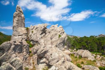 Natural landscape, rocky mountains and dramatic sky on a background. Corsica island, France. Alta Rocca, Ospedale region