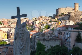 Silhouette of Jesus Christ statue with cross as a part of Saint Francesco Cathedral exterior old Gaeta town, Italy