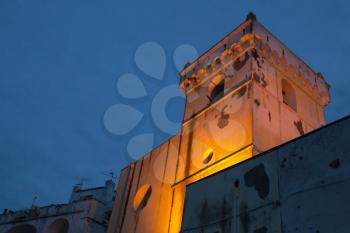 Santa Maria Assunta. Illuminated church facade over dark blue sky, Ischia Porto, Italy