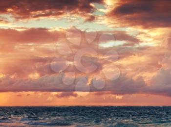 Colorful sunrise sky over Atlantic ocean. Dominican republic, Punta Cana. Toned photo filter filter effect