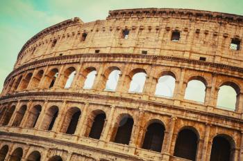 Exterior of the Colosseum or Coliseum, also known as the Flavian Amphitheatre, vintage toned photo with old style effect
