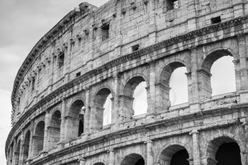 Exterior of the Colosseum or Coliseum, also known as the Flavian Amphitheatre. Black and white photo