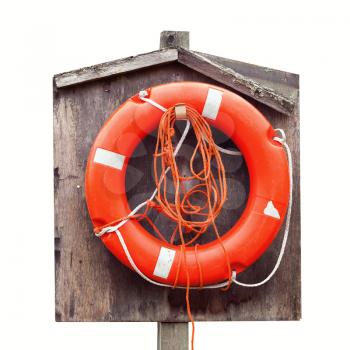 Bright red lifebuoy in wooden case isolated on white