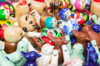 Traditional colorful russian whistles in shape of birds and animals
