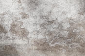 Gray concrete wall with wet spots pattern, grungy background photo texture