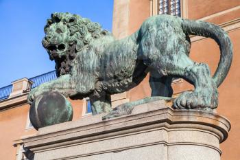 Bronze statue of lion at Royal Palace in old Town of Stockholm, Sweden. Close-up photo