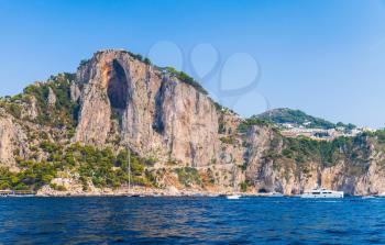 Coastal landscape, rocks of Capri island near Marina Piccola beach. Mediterranean Sea, Italy
