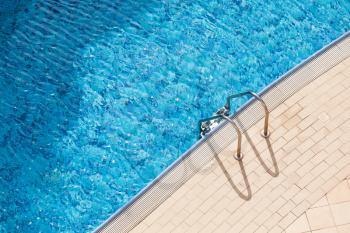 Swimming pool side background photo with depth marking and entrance ladder