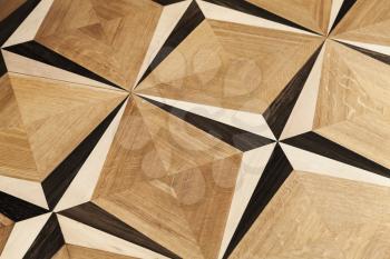 Classical wooden parquet with vintage wind rose pattern, decorative tiling background texture