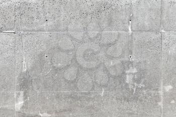 Gray outdoor concrete wall, frontal background photo texture