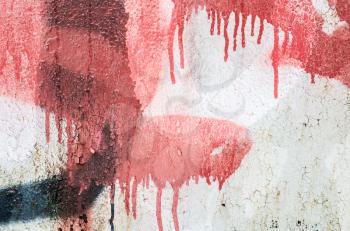 Abstract red and black graffiti fragment over old concrete wall