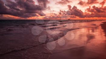 Red sunrise over Atlantic Ocean coast, Bavaro beach, Hispaniola Island. Dominican Republic, coastal landscape