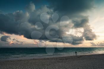 Atlantic ocean coast. Landscape with dramatic stormy clouds in sunrise, Dominican republic. Punta Cana. Bavaro beach