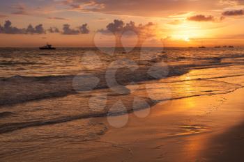 Bright sunrise over Atlantic Ocean. Bavaro beach, Hispaniola Island. Dominican Republic, coastal landscape