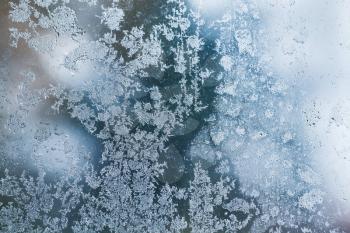 Frost over window glass, close up abstract background photo texture