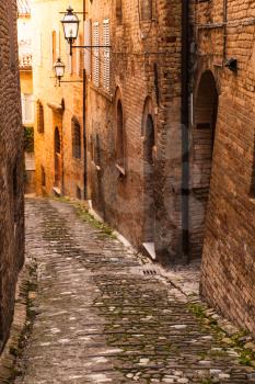 Vertical street view, Warm toned photo of Fermo old town, Italy